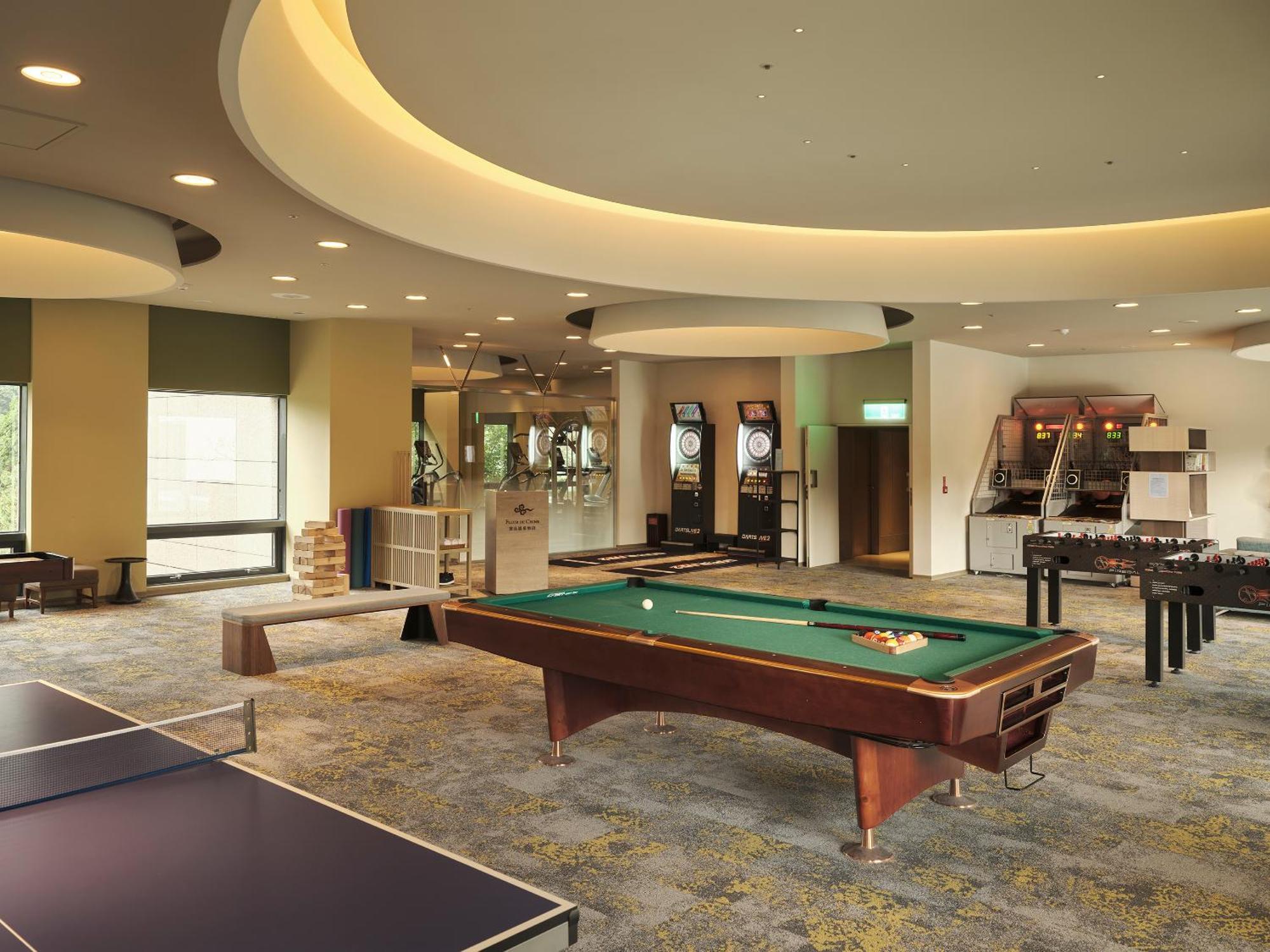 Fleur De Chine Hotel Yuchi Exteriör bild The game room at the clubhouse